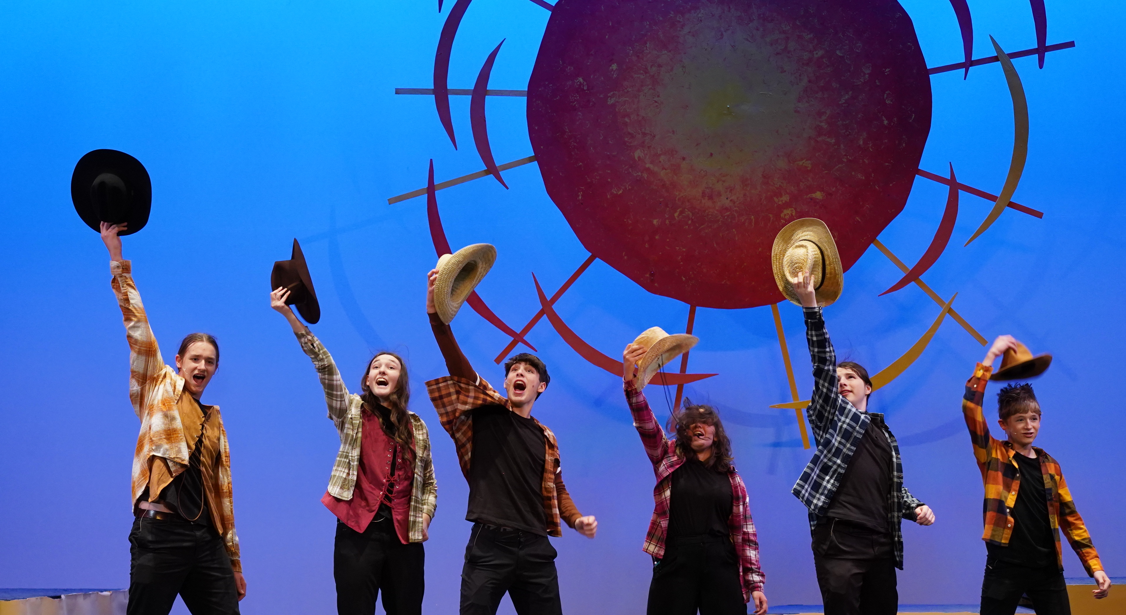 Joseph's Brothers hold hats in the air in Caanan.