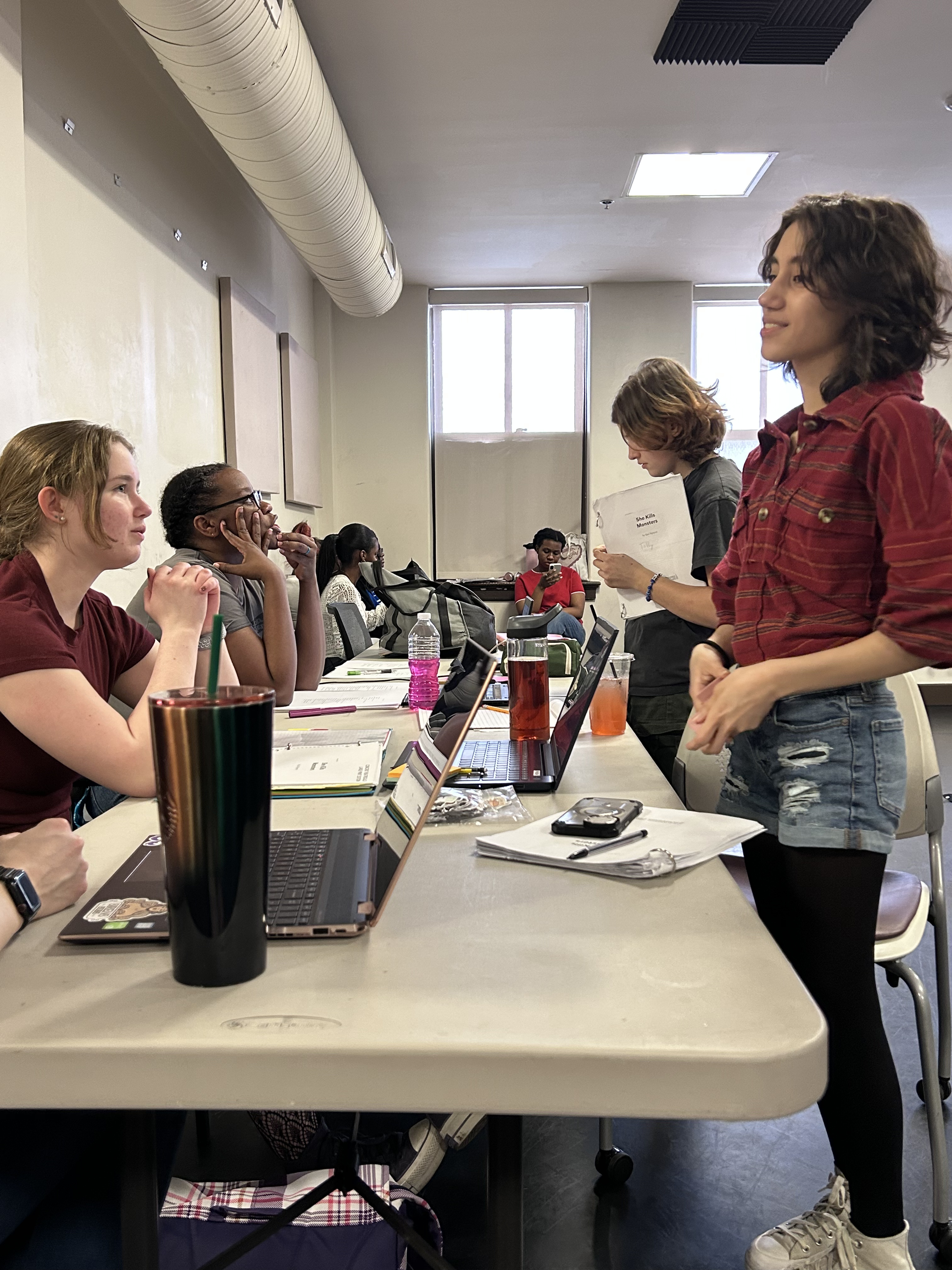 Director and cast at the table.